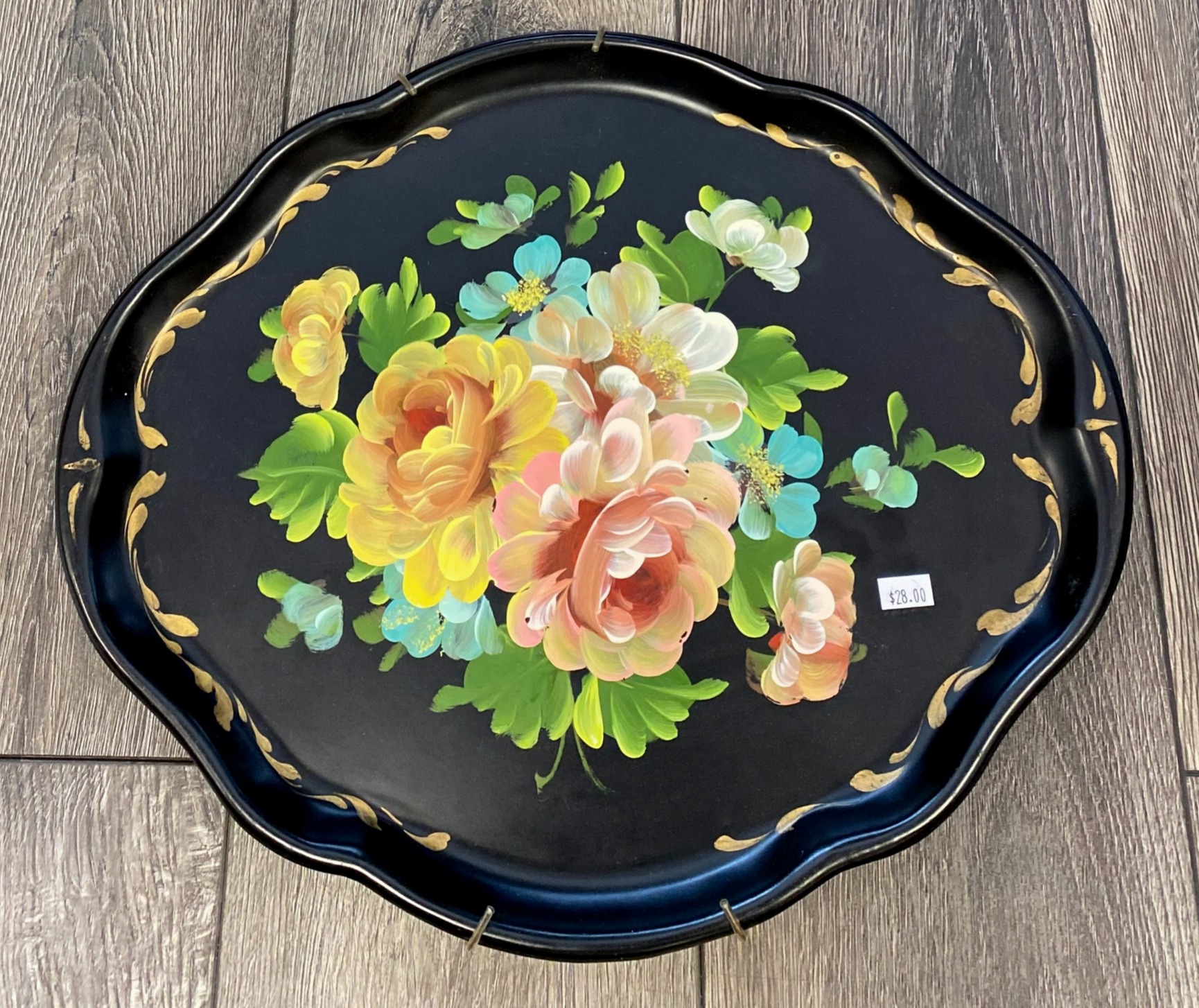 Black toleware tray with floral
motif
