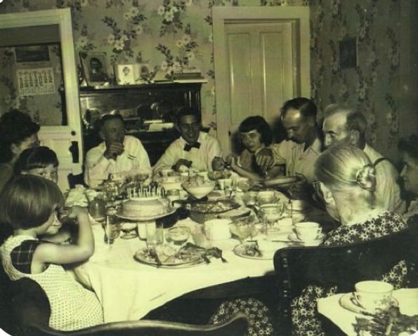 Vintage photo of a family having
dinner
