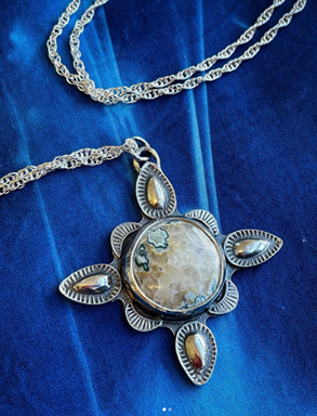 Stone pendant on silver chain necklace