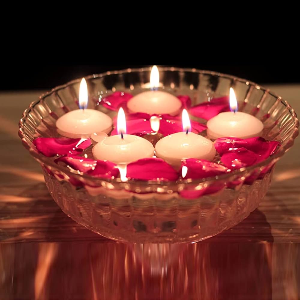 Glass bowl with floating candles and rose petals