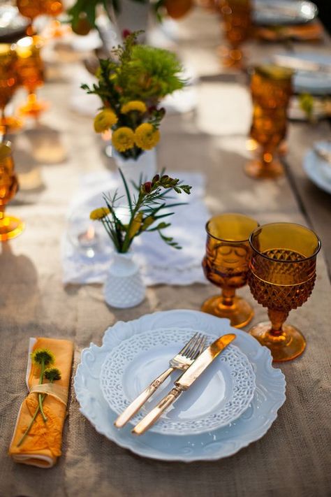 Fall tablescape with white dishes and amber glassware