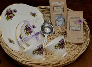 Vintage teacups and dishes in a basket