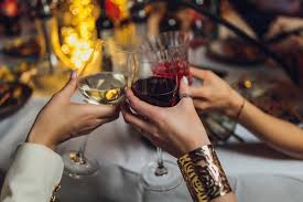 Drinkware and hands toasting