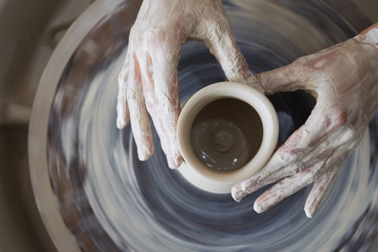 Person making pottery