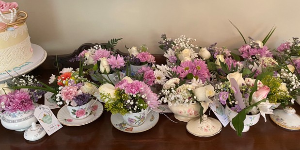 Tea cup favors with fresh flowers
